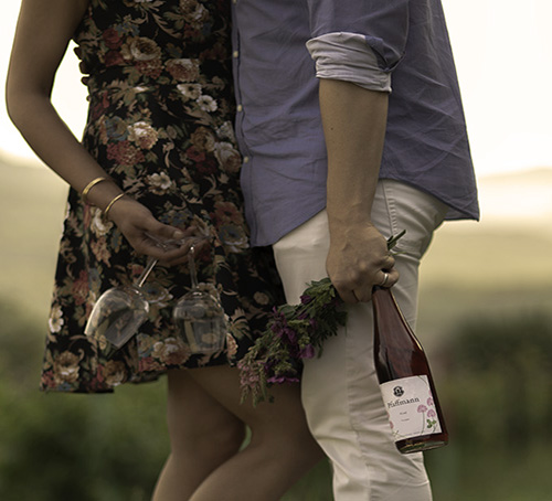 Lovers with fresh flowers and Organic WIne